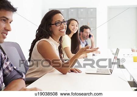 Design Team Collaborating On Project Together View Large Photo Image Stock Photo - Design Team Collaborating On Project Together. Fotosearch