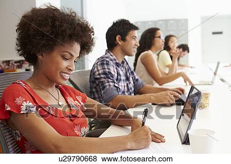 Stock Photo - Design Team Collaborating On Project Together. Fotosearch