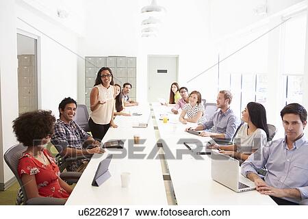 Stock Photo - Design Team Collaborating On Project Together. Fotosearch