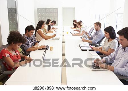 Design Team Collaborating On Project Together View Large Photo Image Stock Photo - Design Team Collaborating On Project Together. Fotosearch