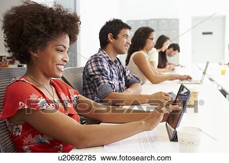 Design Team Collaborating On Project Together View Large Photo Image Stock Photography - Design Team Collaborating On Project Together. Fotosearch