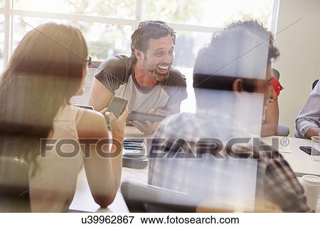 Designers Having Meeting Viewed Through Window View Large Photo Image Stock Photo - Designers Having Meeting Viewed Through Window. Fotosearch