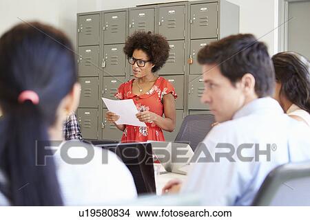 Picture - Designers Meeting To Discuss New Ideas. Fotosearch