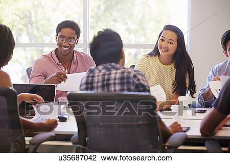 Designers Meeting To Discuss New Ideas View Large Photo Image Stock Image - Designers Meeting To Discuss New Ideas. Fotosearch