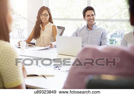 Designers Meeting To Discuss New Ideas View Large Photo Image Stock Photo - Designers Meeting To Discuss New Ideas. Fotosearch