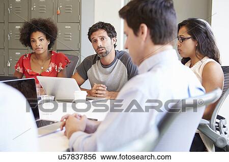 Stock Photograph - Designers Meeting To Discuss New Ideas. Fotosearch