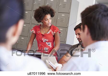 Stock Photograph - Designers Meeting To Discuss New Ideas. Fotosearch