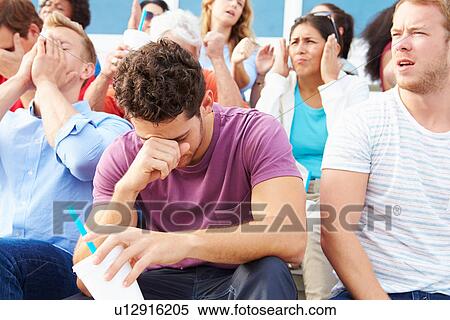 Disappointed Spectators At Outdoor Sports Event View Large Photo Image Stock Photography - Disappointed Spectators At Outdoor Sports Event. Fotosearch