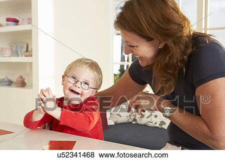 Downs Syndrome boyhaving speech therapy View Large Photo Image Stock Photo - Downs Syndrome boyhaving speech therapy. Fotosearch