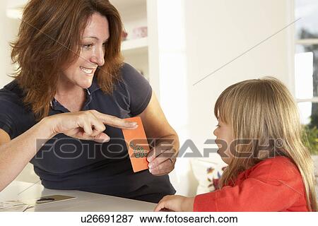 Downs Syndrome girl having speech therapy View Large Photo Image Stock Photo - Downs Syndrome girl having speech therapy. Fotosearch