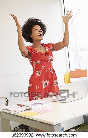 Excited Woman Working At Desk In Design Studio View Large Photo Image Stock Image - Excited Woman Working At Desk In Design Studio . Fotosearch