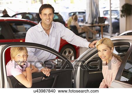 Stock Image - Family buying new car. Fotosearch