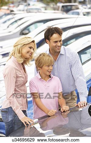 Family buying new car View Large Photo Image Stock Photo - Family buying new car. Fotosearch