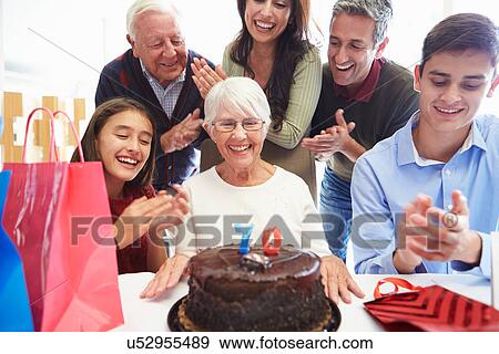 Family Celebrating 70th Birthday Together View Large Photo Image Stock Photo - Family Celebrating 70th Birthday Together. Fotosearch