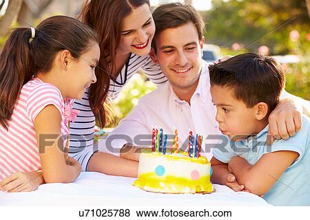 Family Celebrating Birthday Outdoors With Cake View Large Photo Image Stock Photo - Family Celebrating Birthday Outdoors With Cake. Fotosearch