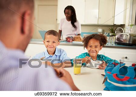 Family Eating Breakfast At Home Together View Large Photo Image Stock Image - Family Eating Breakfast At Home Together. Fotosearch