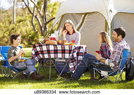Picture - Family Enjoying Camping Holiday In Countryside. Fotosearch