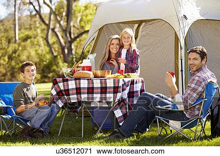 Family Enjoying Camping Holiday In Countryside View Large Photo Image Stock Image - Family Enjoying Camping Holiday In Countryside. Fotosearch