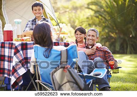 Family Enjoying Camping Holiday In Countryside View Large Photo Image Stock Image - Family Enjoying Camping Holiday In Countryside. Fotosearch