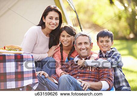 Family Enjoying Camping Holiday In Countryside View Large Photo Image Stock Photograph - Family Enjoying Camping Holiday In Countryside. Fotosearch