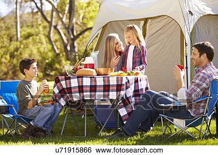 Family Enjoying Camping Holiday In Countryside View Large Photo Image Stock Photograph - Family Enjoying Camping Holiday In Countryside. Fotosearch