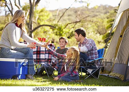 Family Enjoying Camping Holiday In Countryside View Large Photo Image Stock Photography - Family Enjoying Camping Holiday In Countryside. Fotosearch