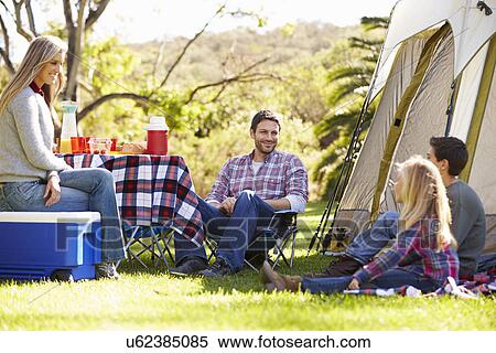 Family Enjoying Camping Holiday In Countryside View Large Photo Image Stock Photography - Family Enjoying Camping Holiday In Countryside. Fotosearch