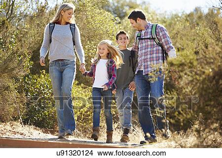 Family Hiking In Countryside Wearing Backpacks View Large Photo Image Picture - Family Hiking In Countryside Wearing Backpacks. Fotosearch