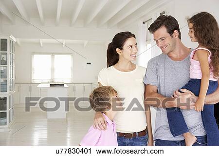Stock Image - Family in new home. Fotosearch