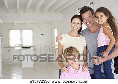 Stock Photograph - Family in new home. Fotosearch