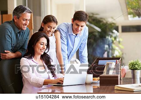 Family Looking At Laptop Together View Large Photo Image Picture - Family Looking At Laptop Together. Fotosearch