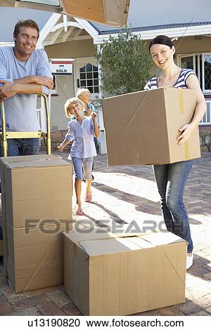Family moving house View Large Photo Image Stock Image - Family moving house. Fotosearch
