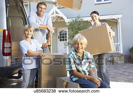 Stock Photo - Family moving house. Fotosearch