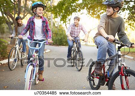 Stock Photography - Family On Cycle Ride In Countryside. Fotosearch