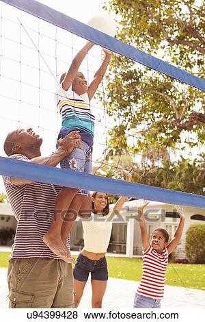 Family Playing Game Of Volleyball In Garden View Large Photo Image Stock Photo - Family Playing Game Of Volleyball In Garden . Fotosearch