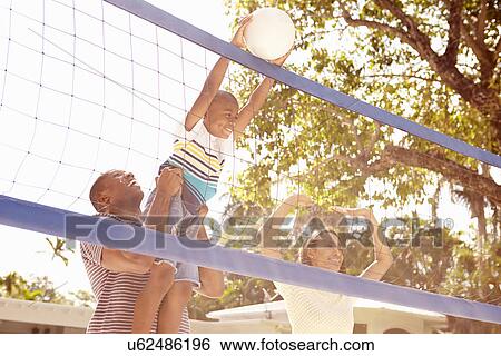 Family Playing Game Of Volleyball In Garden View Large Photo Image Stock Photograph - Family Playing Game Of Volleyball In Garden . Fotosearch