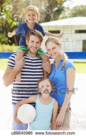 Family Playing Game Of Volleyball In Garden View Large Photo Image Stock Photograph - Family Playing Game Of Volleyball In Garden . Fotosearch