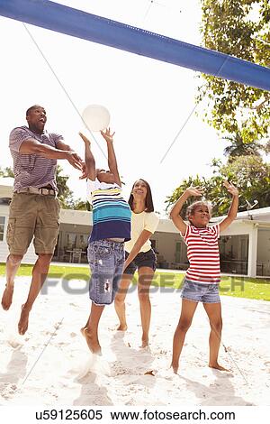Family Playing Game Of Volleyball In Garden View Large Photo Image Stock Photography - Family Playing Game Of Volleyball In Garden . Fotosearch