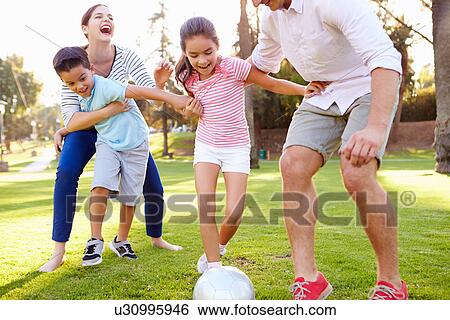Family Playing Soccer In Park Together View Large Photo Image Stock Photograph - Family Playing Soccer In Park Together. Fotosearch