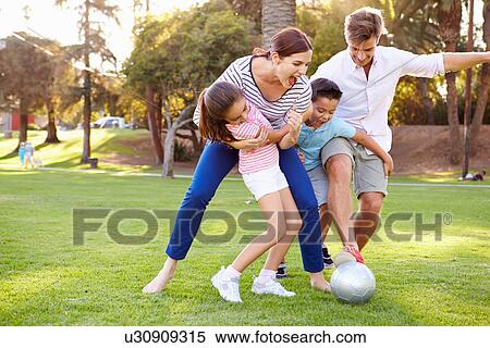 Family Playing Soccer In Park Together View Large Photo Image Stock Photography - Family Playing Soccer In Park Together. Fotosearch