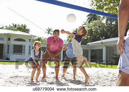 Family Playing Volleyball In Garden At Home View Large Photo Image Picture - Family Playing Volleyball In Garden At Home. Fotosearch