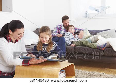 Family Relaxing Indoors Together View Large Photo Image Stock Image - Family Relaxing Indoors Together. Fotosearch