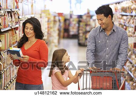 Family shopping in supermarket View Large Photo Image Stock Image - Family shopping in supermarket. Fotosearch