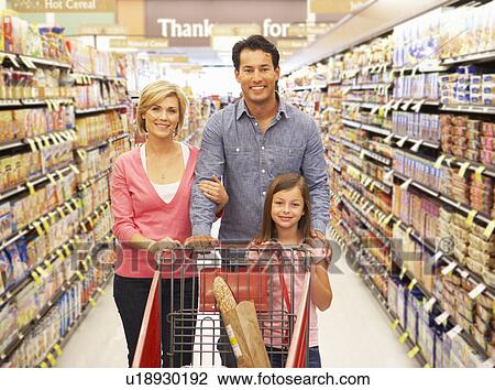 Stock Image - Family shopping in supermarket. Fotosearch