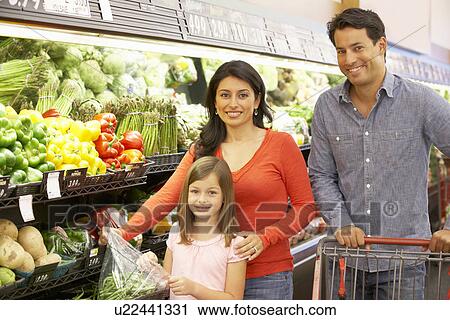 Stock Image - Family shopping in supermarket. Fotosearch
