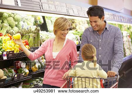 Family shopping in supermarket View Large Photo Image Stock Image - Family shopping in supermarket. Fotosearch