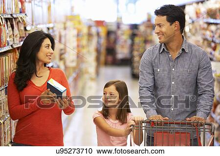 Stock Image - Family shopping in supermarket. Fotosearch