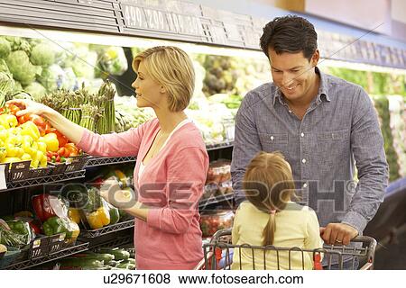 Family shopping in supermarket View Large Photo Image Stock Photo - Family shopping in supermarket. Fotosearch