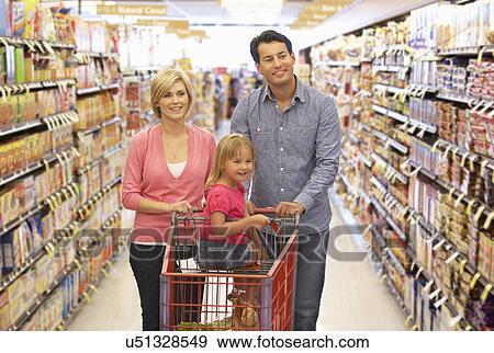 Stock Photo - Family shopping in supermarket. Fotosearch