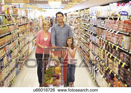 Family shopping in supermarket View Large Photo Image Stock Photograph - Family shopping in supermarket. Fotosearch